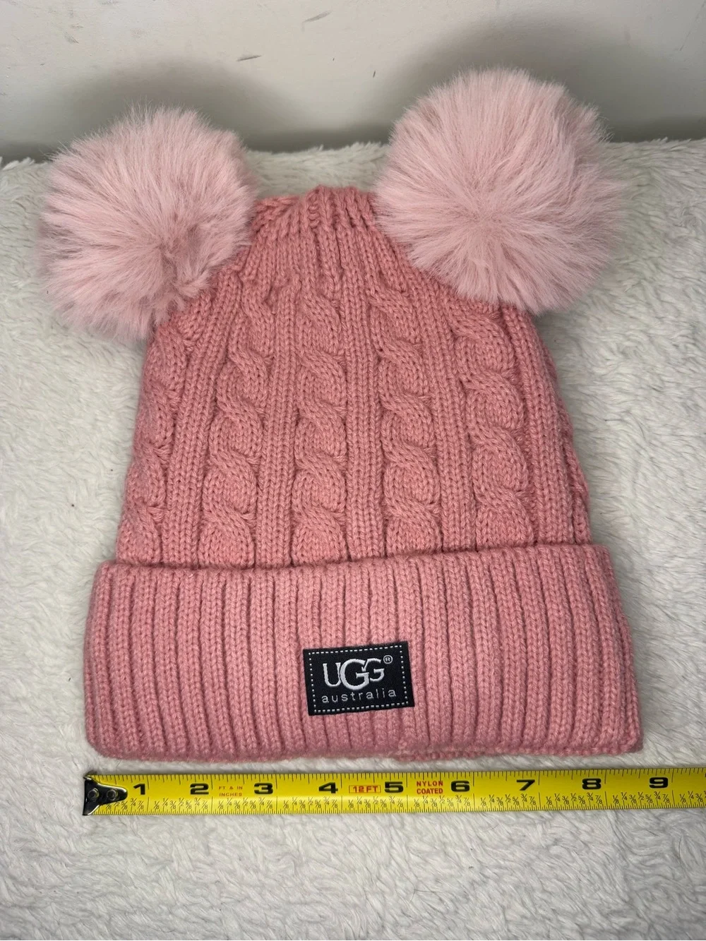 UGG Kids Blush Pink Cable Knit Hat with Dual Faux-Fur Poms